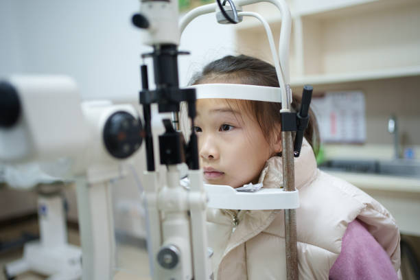 istock Asian children having their eyesight tested 2197576926