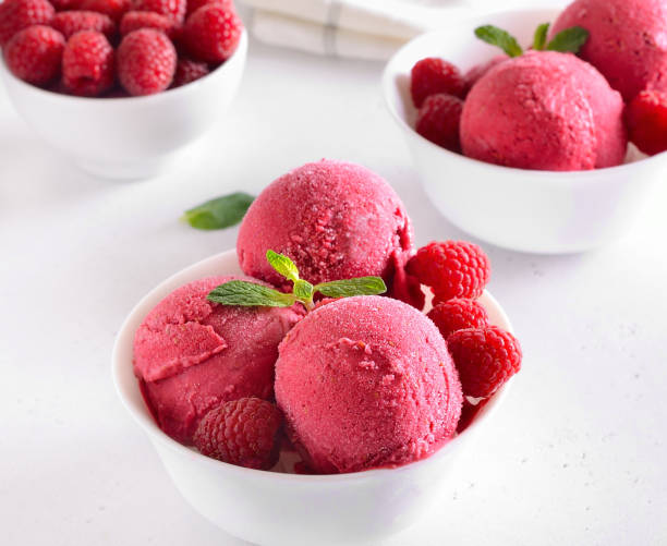 istock Homemade raspberry ice cream scoop with fresh raspberries 2197578989
