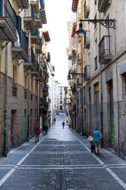 Pamplona, Spain - 22nd August 2021: Calle de la Estafeta features local residents strolling and enjoying the day.