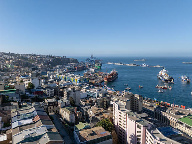 istock Coastal Cityscape with Docked Cargo Ships and Urban Buildings 2197580421