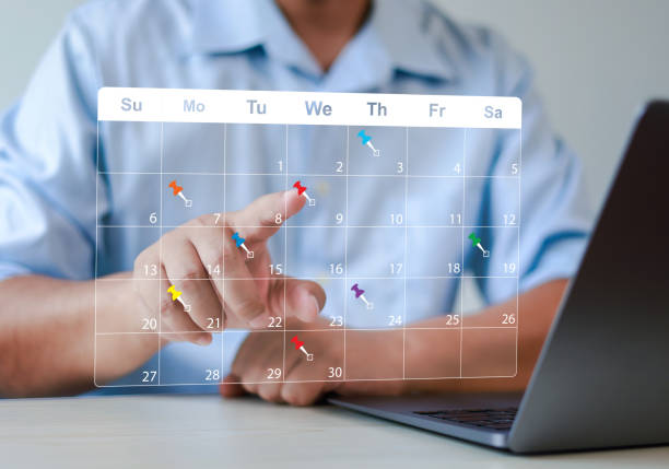 istock Red pin on calendar in office work time management concept. Task planner or personal management tool for business meeting and appointment reminder and schedule planning. 2197583492