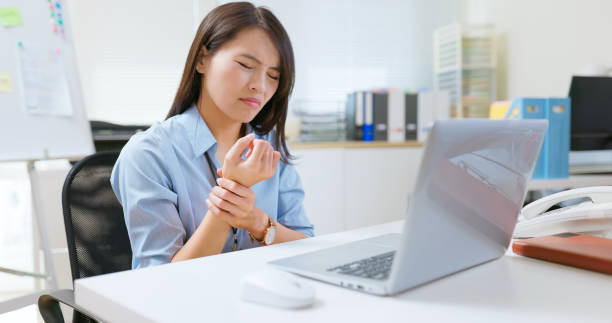 istock businesswoman has wrist pain 2197585182