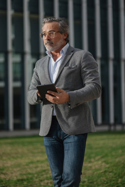istock Pensive Professional Enjoying Outdoor Technology Use 2197587104