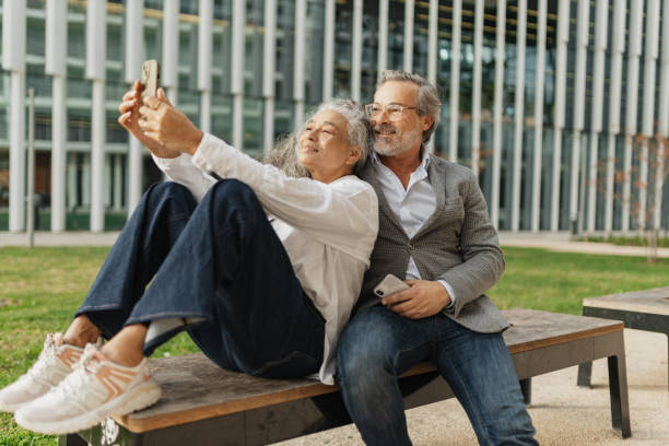 istock Couple Smiling Together Capturing Selfie Outdoors 2197587305
