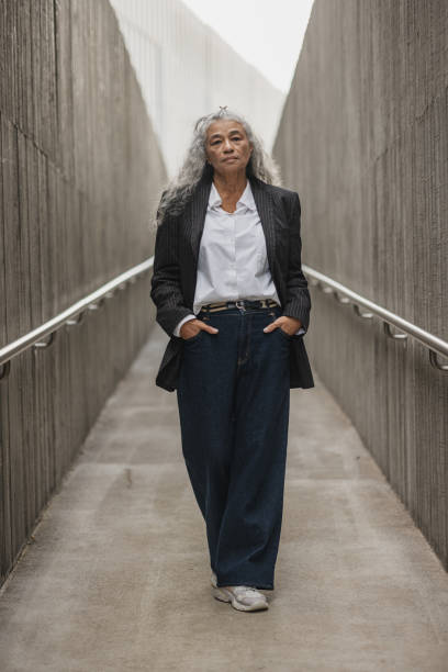 istock Stylish Woman Walking in Urban Setting 2197589385