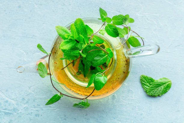 istock Mint tea. A tea pot with fresh mint leaves steeping in hot water 2197590900