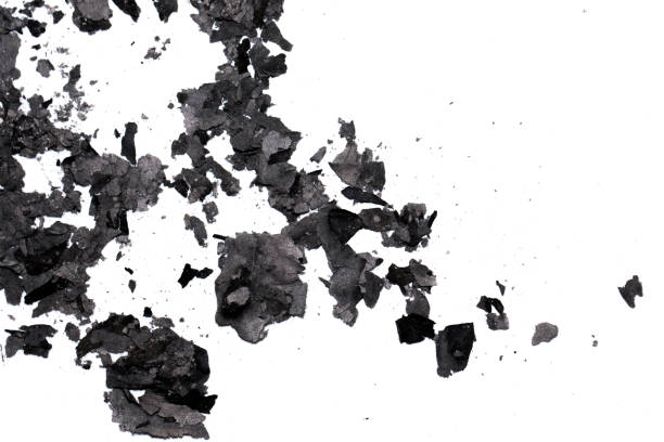 istock Scattered burnt ashes and debris on a white background 2197591819