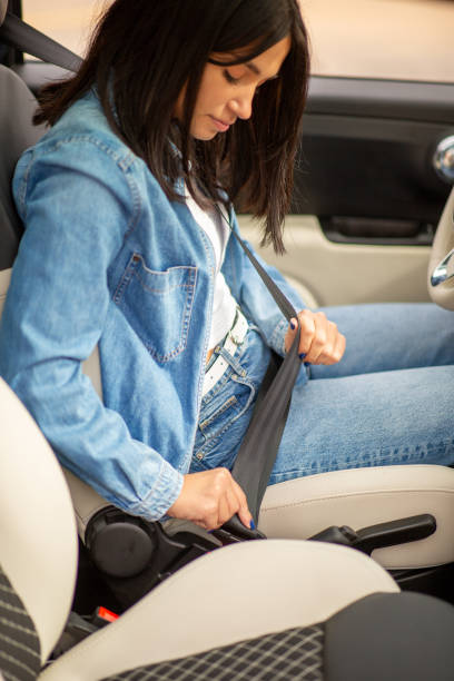 istock young woman hands adjusting seat belt buckle 2197594982