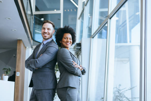 istock Business team of two with man leading the pose 2197595072
