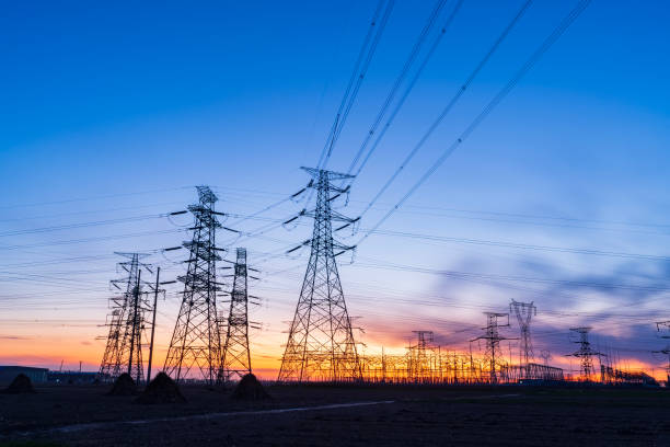 istock Pylons, high voltage pylons in the evening 2197595877