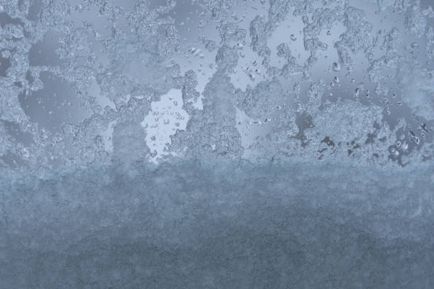 istock Glass covered with snow and water droplets 2197598820
