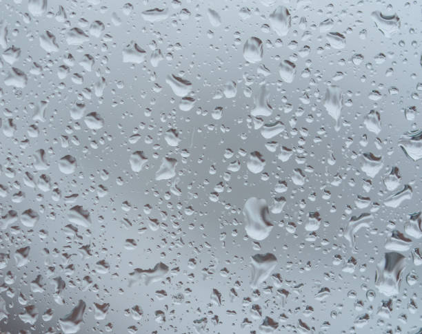 istock The glass is covered with raindrops. Macro photo 2197598834