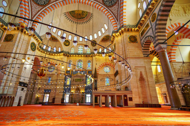 istock interior of mosque, domes are painted with patterns, decorative windows and columns, chandeliers, beautiful architecture of Islamic religion, Istanbul, Turkey 2197599722