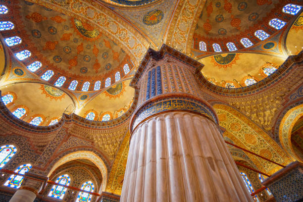 istock interior of mosque, ceiling, domes are painted with patterns, decorative windows and columns, chandeliers, beautiful architecture of Islamic religion, Istanbul, Turkey 2197599900