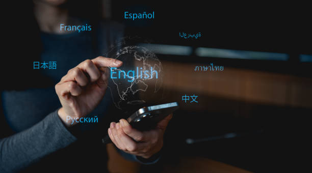 istock A person interacts with a smartphone displaying various language options, highlighting English among others. 2197599938