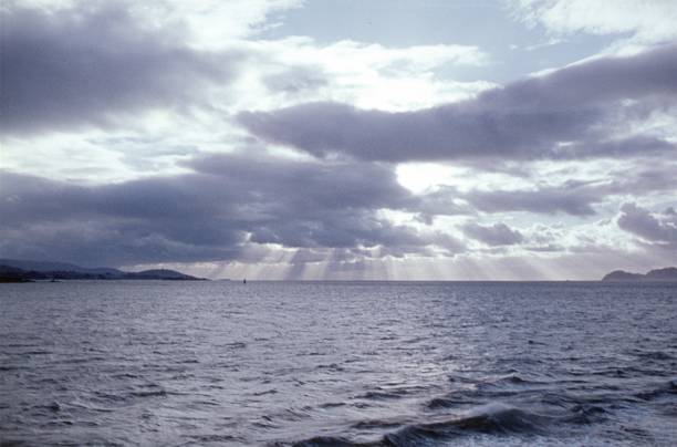 Galicia, Spain, 1960. Sunrays break through the clouds on the Galician coast.