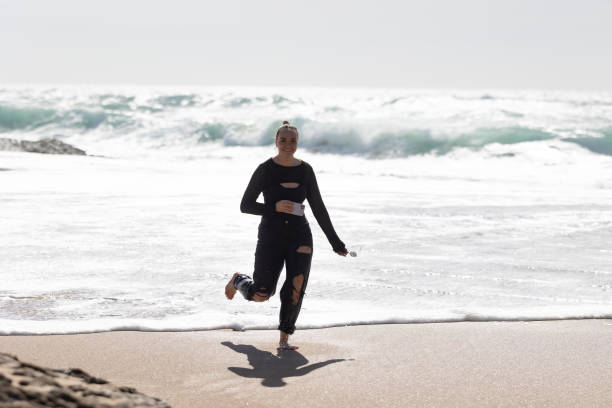 istock Happy woman Running on Beach 2197600357