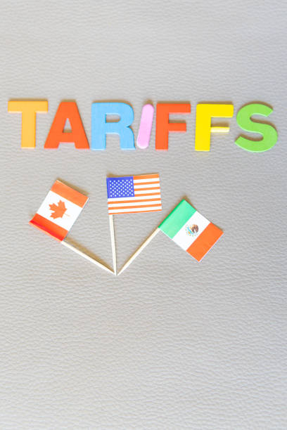 istock Forgiveness Tariffs to Canada and Mexico. Word (TARIFFS) and flags of all three. Copy space on textured background. U.S. trade policy. Vertical photo. Trump game 2197603870