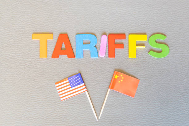 istock U.S.-China tariff dispute. Trade War for Technological Supremacy. Word (TARIFFS) and flags with copy space on textured background. Trump game 2197603892