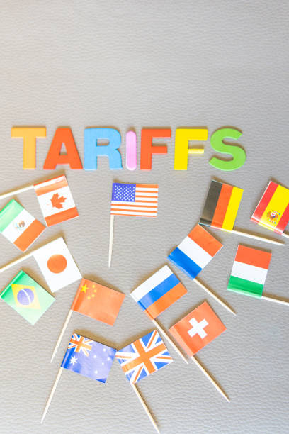 U.S. Tariff trade war policy backfires. Symbol Several countries fight back with Tariffs. Word (TARIFFS) written. Copy space on textured background. Vertical photo. against Trump