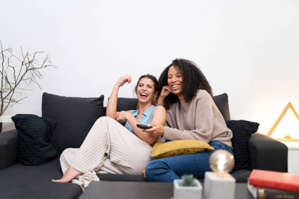istock LGBT couple watching TV together 2197607285