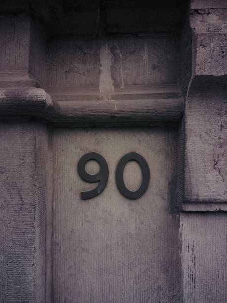 House number ninety and the metal is oxidized
