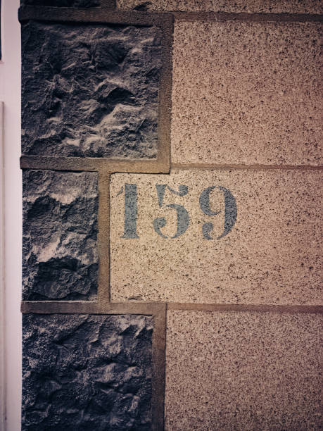 istock House number one hundred fifty nine on textured beige surface. 2197609854