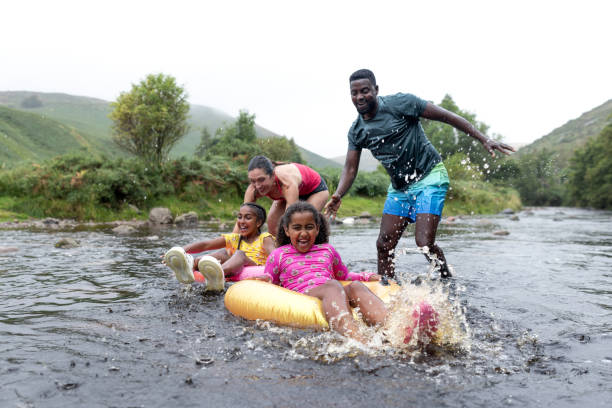 istock Playing With Rubber Rings In The River 2197612764