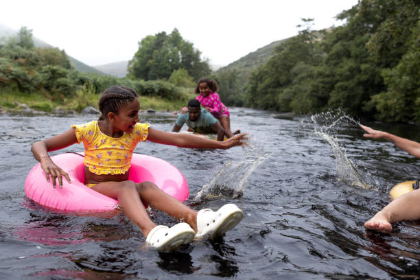 istock Daughter And Mother Splashing Each Other 2197612827