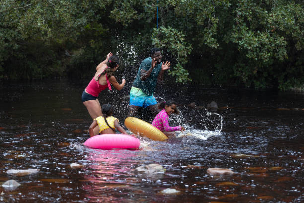 istock Splashing Each Other In The River 2197613168