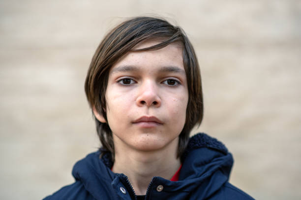 istock Portrait of a young boy starting to develop acne on his face 2197615230