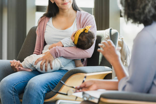istock Mother Holding Baby, Seeking Emotional Support 2197618090