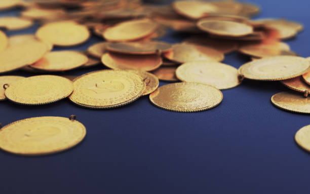 istock Turkish Jewelry Gold Coins on Navy Blue Fabric (Depth Of Field) 2197620242