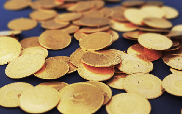 istock Turkish Jewelry Gold Coins on Navy Blue Fabric (Depth Of Field) 2197620253