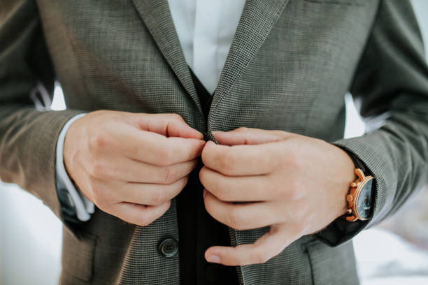 istock Fastening the Suit  A Moment of Confidence 2197621425