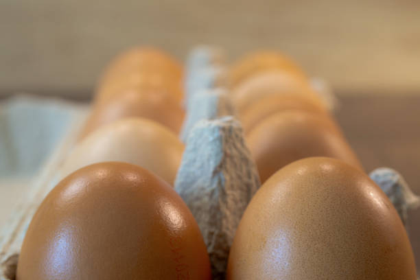 istock hen eggs in carton box close up 2197621576