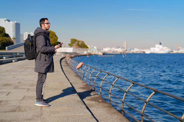 istock A man is watching the scenery by the seaside. 2197621980