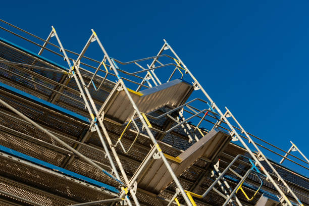 istock Contemporary scaffolding against a clear blue sky at construction site 2197622237