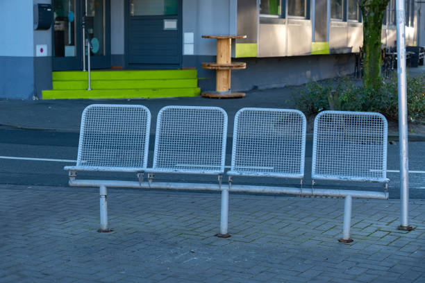Close up of contemporary modern stainless steel street or park bench