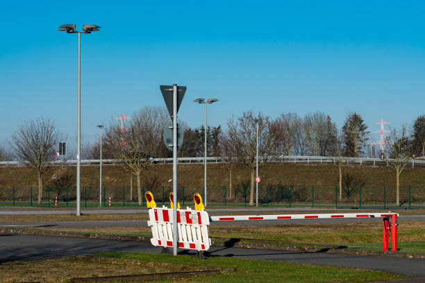 istock Security barrier at an empty parking area during clear weather 2197623233
