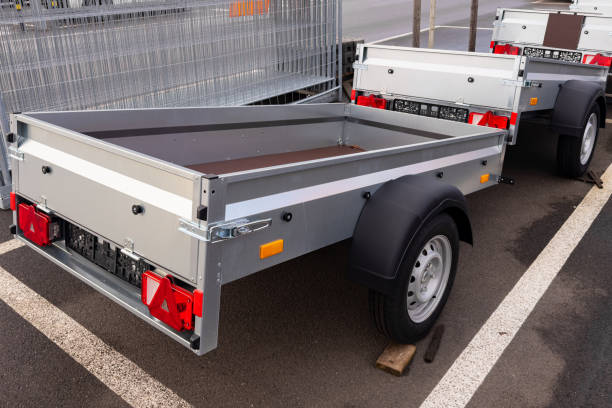 Cargo trailers for passenger car parked in a spacious lot