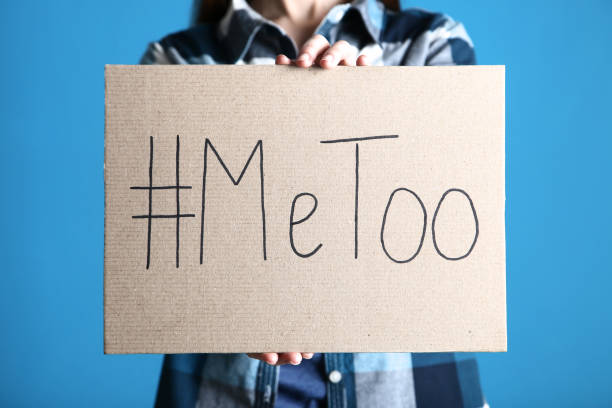 istock Woman holding paper with text Me Too on blue background 2197624399