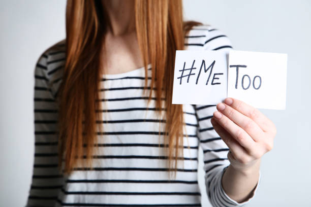 istock Woman holding paper with text Me Too on grey background 2197624702