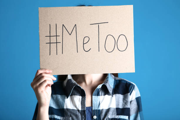 istock Woman holding paper with text Me Too on blue background 2197624821