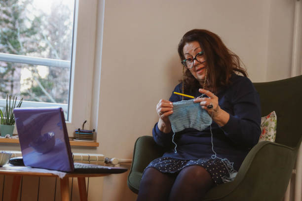 istock Senior woman learns to crochet online 2197624938