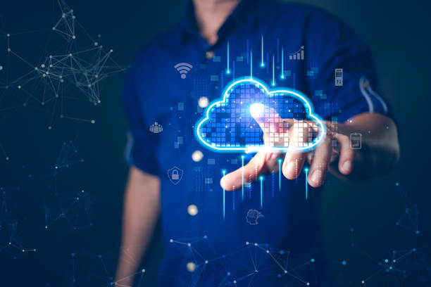 istock A person interacting with a glowing digital cloud icon, surrounded by futuristic interface elements, representing cloud computing, data storage, cybersecurity, and modern technology advancements. 2197625453