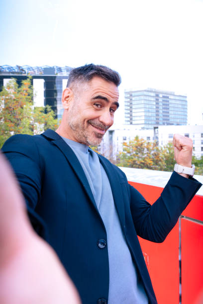 istock Cheerful Man Taking a Selfie Outdoors in Urban Environment 2197627088