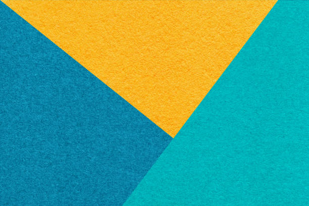 istock Texture craft yellow, blue and turquoise paper background, macro. Structure vintage abstract cerulean cardboard 2197627729