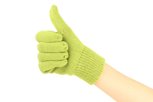 Hand in knitted mitten showing thumb up on white background