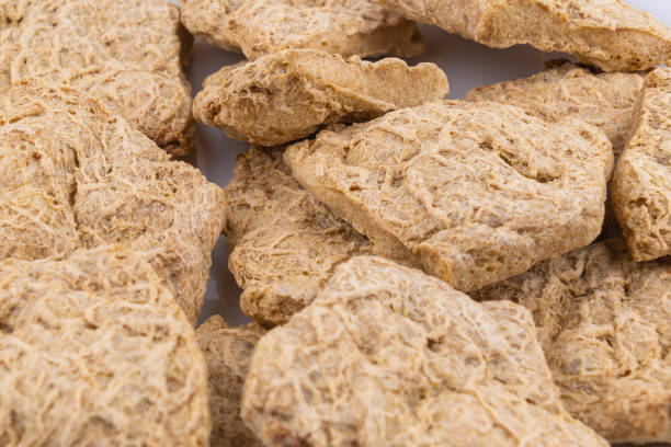 istock Dried soy meat pieces on a white plate. textured vegetable protein. 2197629979